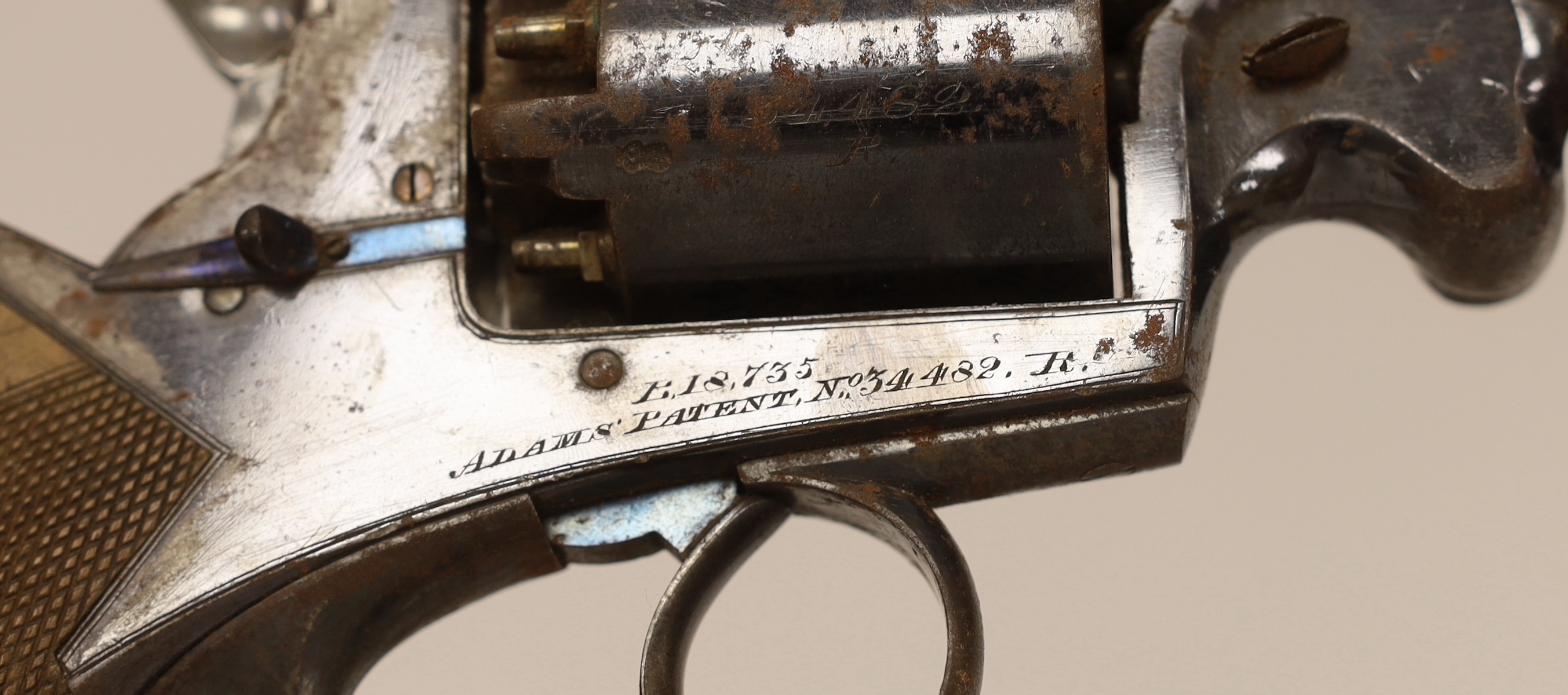 A five shot 38 bore Beaumont Adams patent double action percussion Dragoon pistol, retaining much of its original blued finish, top strap engraved Robert Adams 76 King William Street London